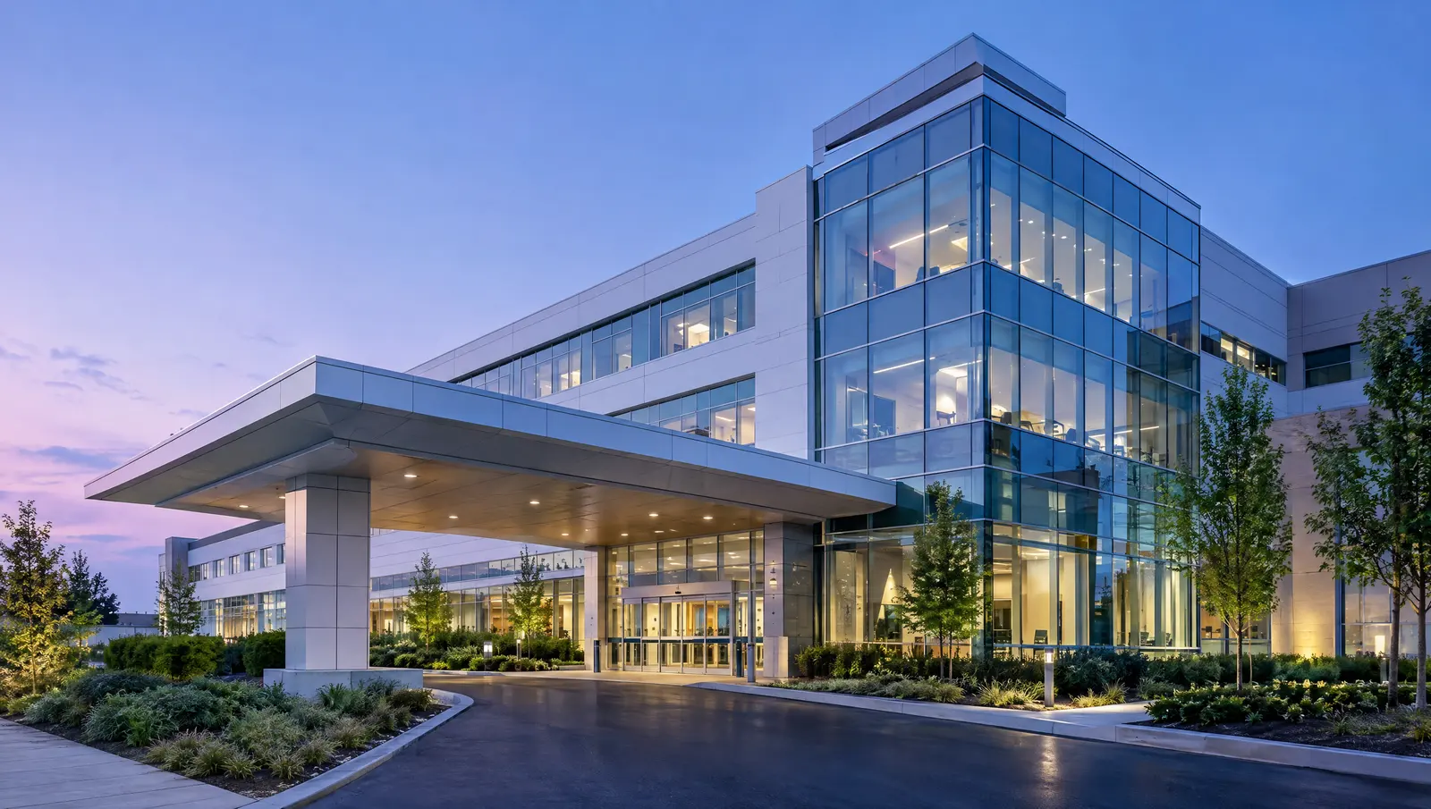 A modern hospital building at dusk